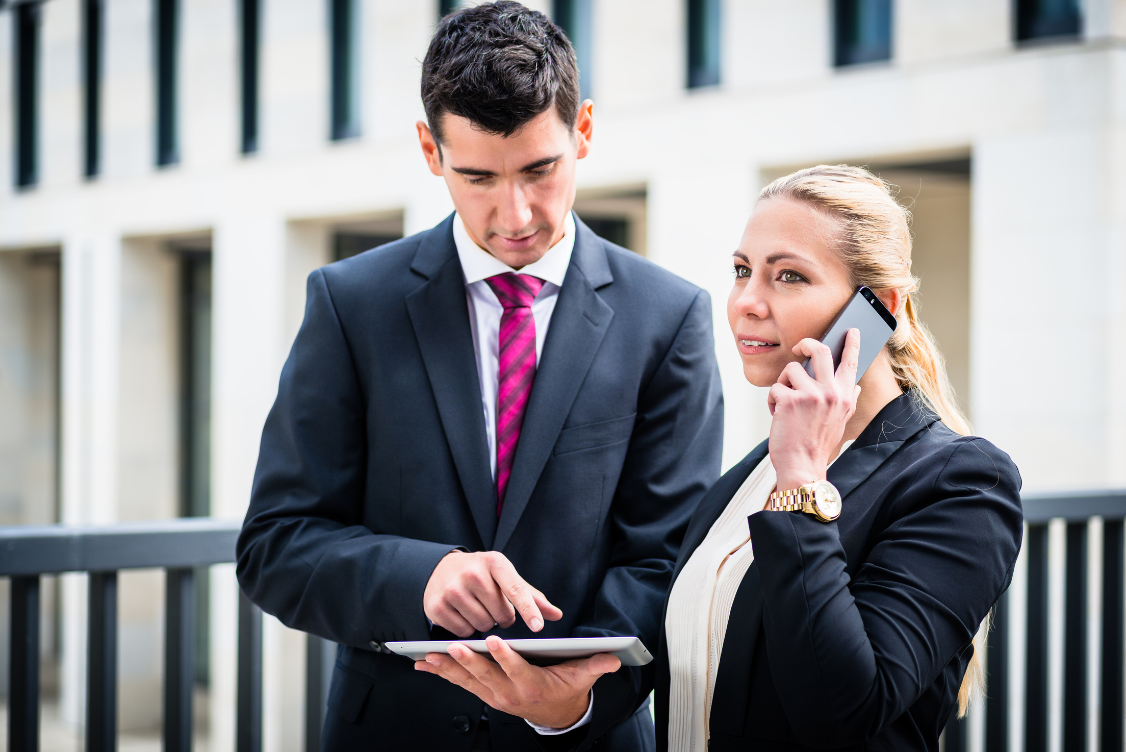 Business Man and Woman Working Outdoors